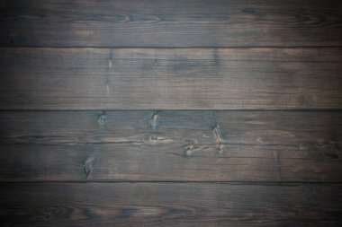 Ağaç dalları ve çizgileri olan kahverengi tahta bir duvar. Kahverengi arkaplan, ahşap desenli ve canlı..