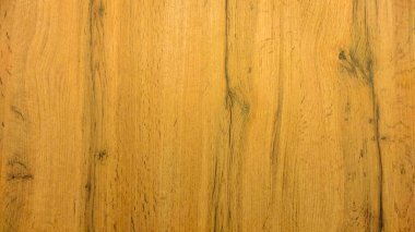 Tahta doku, dikey çizgilerle sarıdır. Ahşap yüzey.