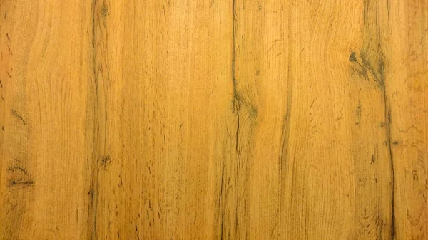 Tahta doku, dikey çizgilerle sarıdır. Ahşap yüzey.