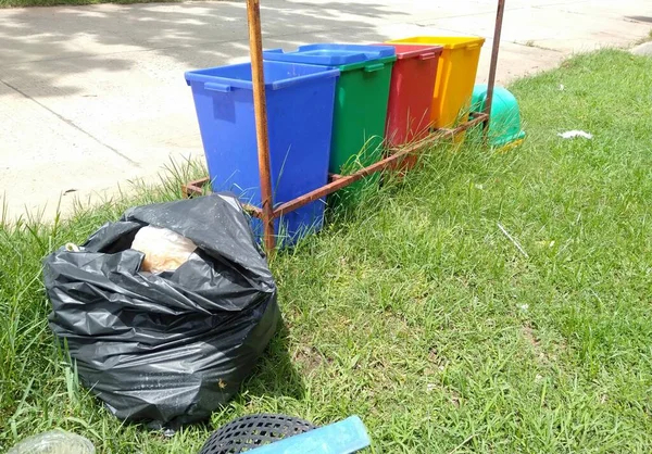 trash bin lying on the lawn