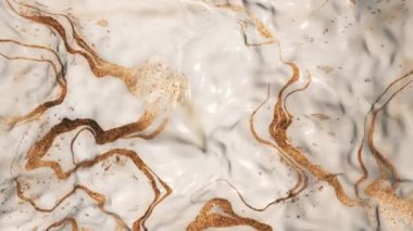 Gently flowing and rippling golden liquid Italian marble motion background animation.