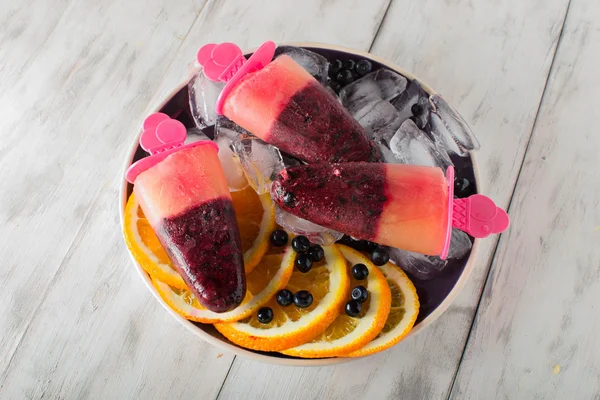 Popsicles with blueberries and orange — Stock Photo, Image