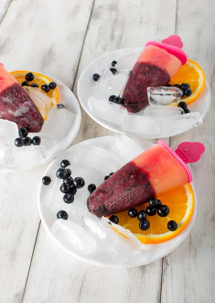 Popsicles with blueberries and orange — Stock Photo, Image