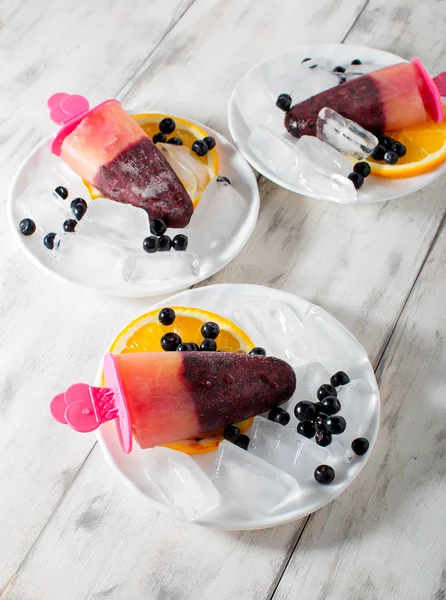 Popsicles with blueberries and orange — Stock Photo, Image