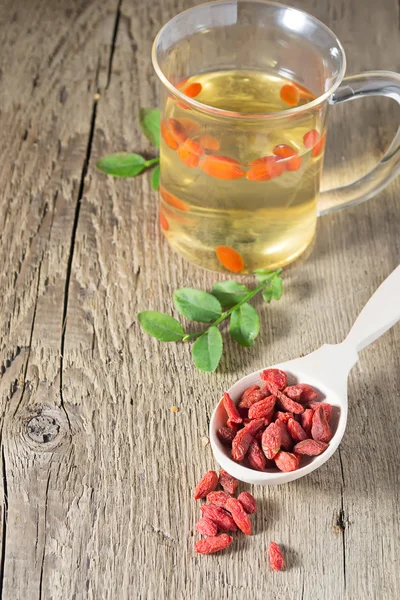 Goji berries in wooden background — Stock Photo, Image