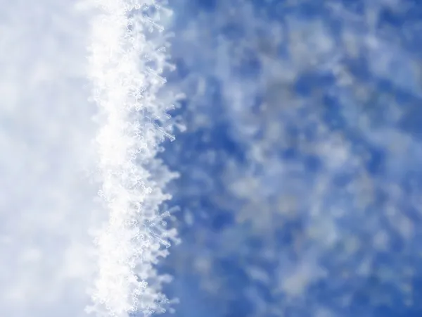 Fondo azul invierno con copos de nieve —  Fotos de Stock