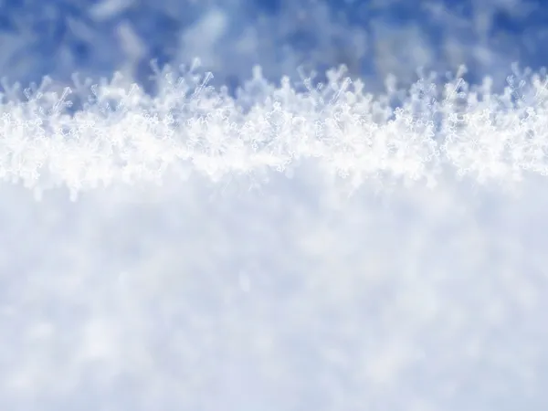 Sfondo blu invernale con fiocchi di neve — Foto Stock