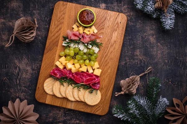 Appetizers plate in shape of Christmas tree. — Stock Photo, Image