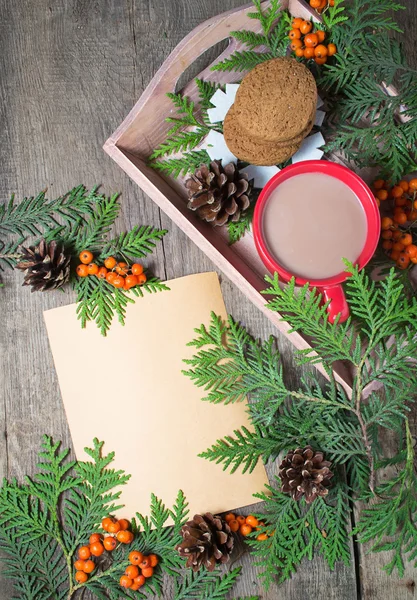Christmas card with cup of cocoa, fir tree, pinecones and rowan — Stock Photo, Image