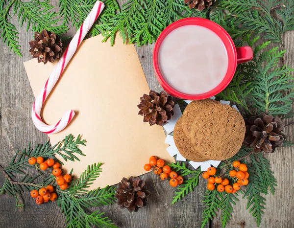 Christmas card with cup of cocoa, fir tree, pinecones and rowan — Stock Photo, Image