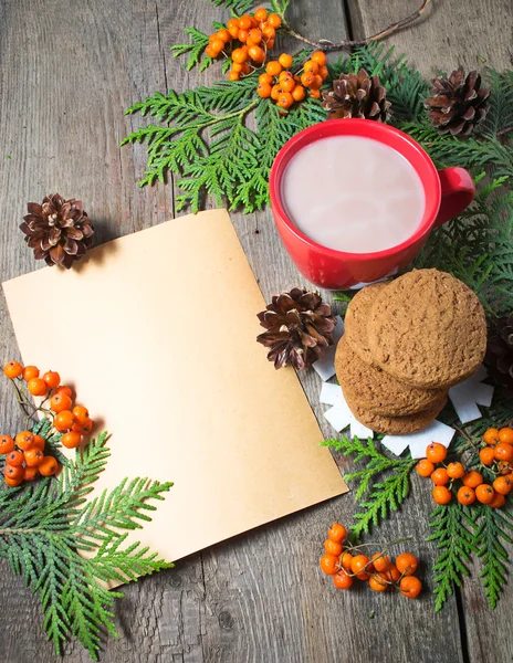 Christmas card with cup of cocoa, fir tree, pinecones and rowan — Stock Photo, Image