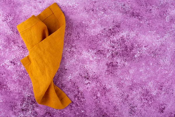 Linen napkin on lilac concrete background — 스톡 사진