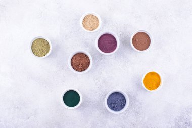 Various superfoods powder. Acai, matcha, spirulina, ginger dried blueberry and turmeric