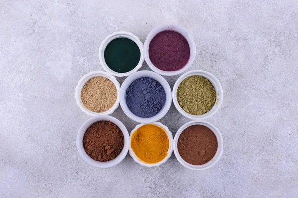 stock image Various superfoods powder. Acai, matcha, spirulina, ginger dried blueberry and turmeric