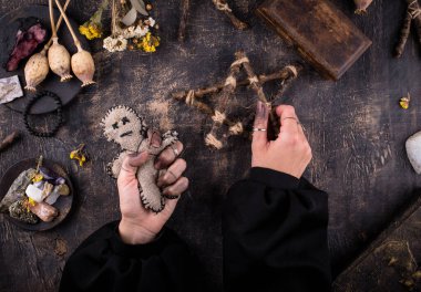 Voodoo doll. Black magic witch esoteric ritual. Halloween concept