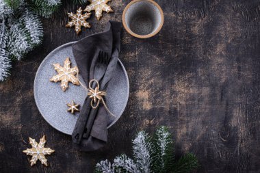 Christmas and New year table setting with gingerbread cookies