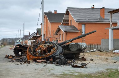 Dmytrivka village, Kyiv region, Ukraine - April 13, 2022: Destroyed Russian tank following the Ukrainian forces counter-attacks. War of Russia against Ukraine.