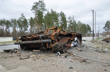 Dmytrivka village, Kyiv region, Ukraine - April 13, 2022: Destroyed Russian tank following the Ukrainian forces counter-attacks. War of Russia against Ukraine.