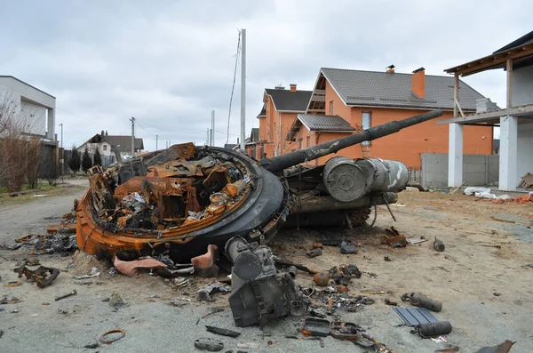 Dmytrivka village, Kyiv region, Ukraine - April 13, 2022: Destroyed Russian tank following the Ukrainian forces counter-attacks. War of Russia against Ukraine.