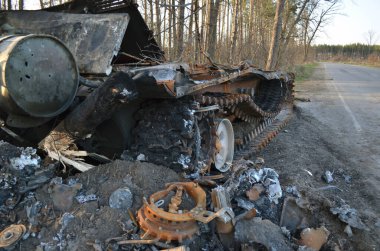 Dmytrivka village, Kyiv region, Ukraine - April 14, 2022: Destroyed Russian tank following the Ukrainian forces counter-attacks. War of Russia against Ukraine.