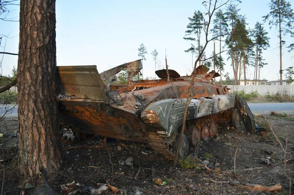 Dmytrivka village, Kyiv region, Ukraine - April 14, 2022: Destroyed infantry fighting vehicle with a white painting V of the Russian army following the Ukrainian forces counter-attacks.