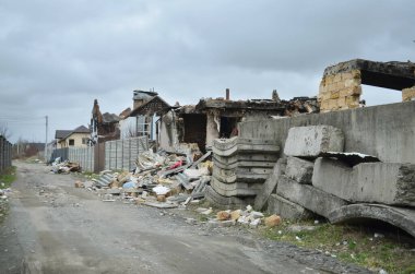 Dmytrivka village, Kyiv region, Ukraine - April 13, 2022: Destroyed private houses during active hostilities in Ukraine. War of Russia against Ukraine.