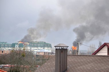 Myla village, Kyiv region, Ukraine - March 03, 2022: Residential buildings is on fire as a result of shelling from a tank on the first day of occupation of the village by russian army.