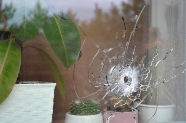 Dmytrivka, Kyiv region, Ukraine - April 06, 2022: Broken window of a private house as a result of active hostilities in the Kyiv region during the Russian invasion of Ukraine.
