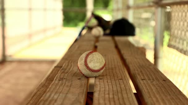 Youth Player Hand Grabs Baseball Team Bench Dugout — Vídeo de stock