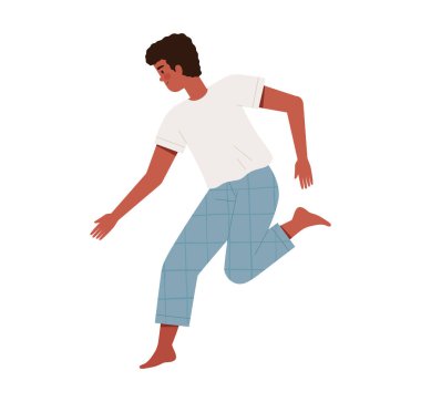 Rahat pijamalı genç adam uyandıktan sonra neşeyle atlar ya da dans eder. Günaydın ve sağlıklı uyku konsepti.