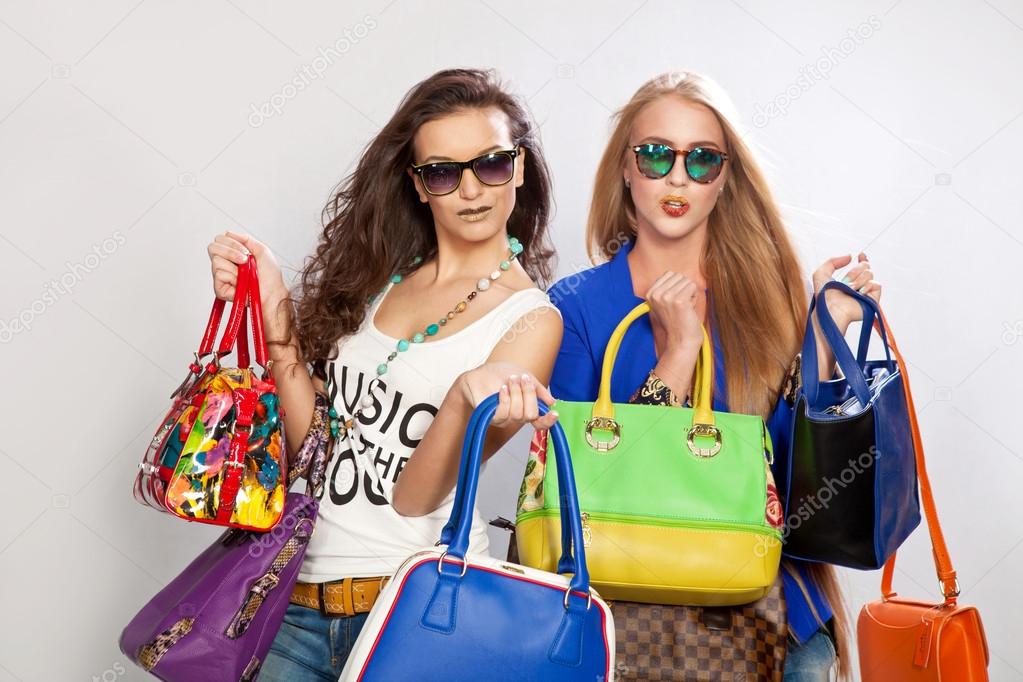 Women with bags and smiling