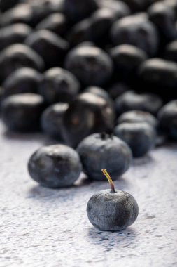 Macro close up of unwashed blueberries. 