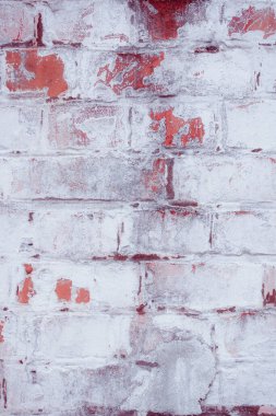 Çatlakları ve çizikleri olan tuğla duvar dokusu arka plan olarak kullanılabilir.