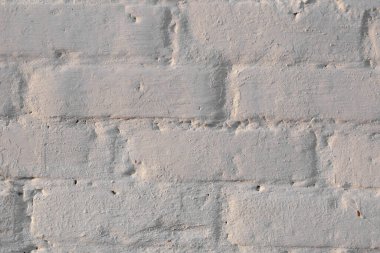 Çatlakları ve çizikleri olan beton bir duvarın dokusu arka plan olarak kullanılabilir.
