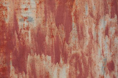 Çizik ve çatlaklarla eski paslı metal dokusu.