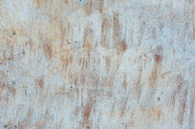 Çizik ve çatlaklarla eski paslı metal dokusu.