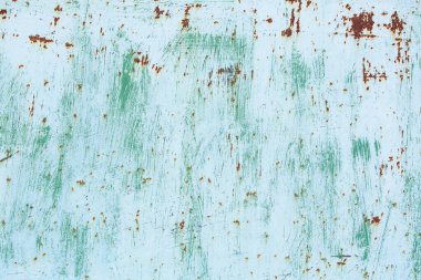 Çizik ve çatlaklarla eski paslı metal dokusu.