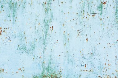 Çizik ve çatlaklarla eski paslı metal dokusu.