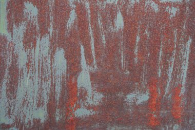 Çizik ve çatlaklarla eski paslı metal dokusu.