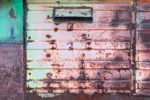 old rusty metal plate with a blue background