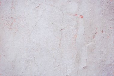 Çatlakları ve çizikleri olan eski beton duvarın dokusu arka plan olarak kullanılabilir.