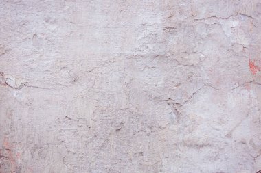 Çatlakları ve çizikleri olan eski beton duvarın dokusu arka plan olarak kullanılabilir.