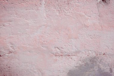 Çatlakları ve çizikleri olan eski beton duvarın dokusu arka plan olarak kullanılabilir.