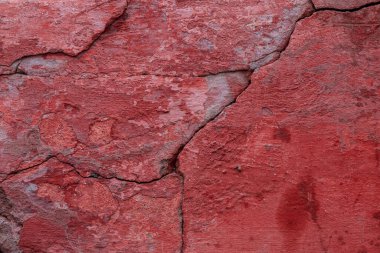 Çatlakları ve çizikleri olan taş bir duvarın dokusu arka plan olarak kullanılabilir.