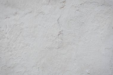 Çatlakları ve çizikleri olan beton bir duvarın dokusu arka plan olarak kullanılabilir.
