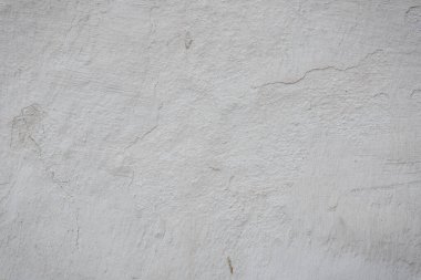 Çatlakları ve çizikleri olan beton duvar dokusu arka plan olarak kullanılabilir.