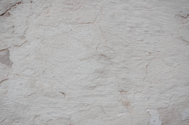 Çatlakları ve çizikleri olan eski beton duvarın dokusu arka plan olarak kullanılabilir.