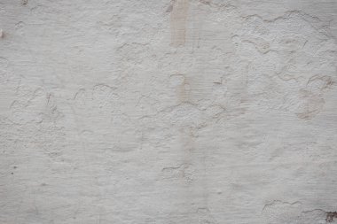 Çatlakları ve çizikleri olan eski beton duvarın dokusu arka plan olarak kullanılabilir.