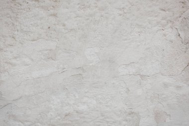 Çatlakları ve çizikleri olan eski beton duvarın dokusu arka plan olarak kullanılabilir.