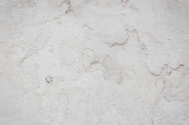 Çatlakları ve çizikleri olan eski beton duvarın dokusu arka plan olarak kullanılabilir.